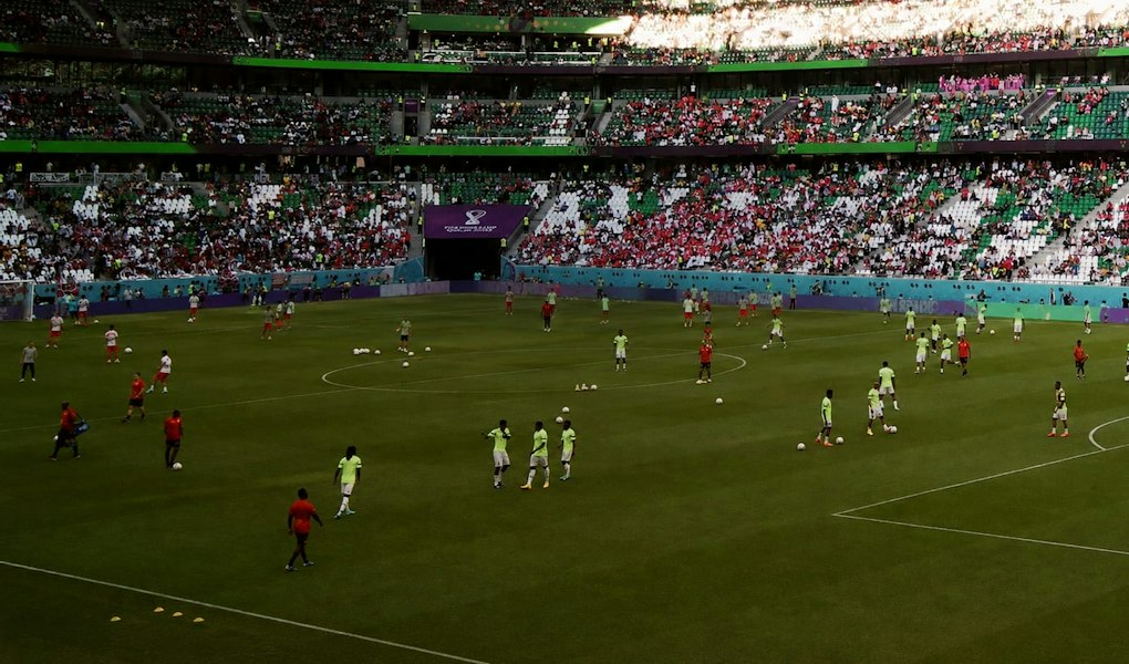 Caption for image Football match seen from the stands