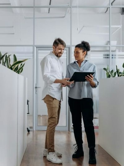 Two colleagues looking at a tablet