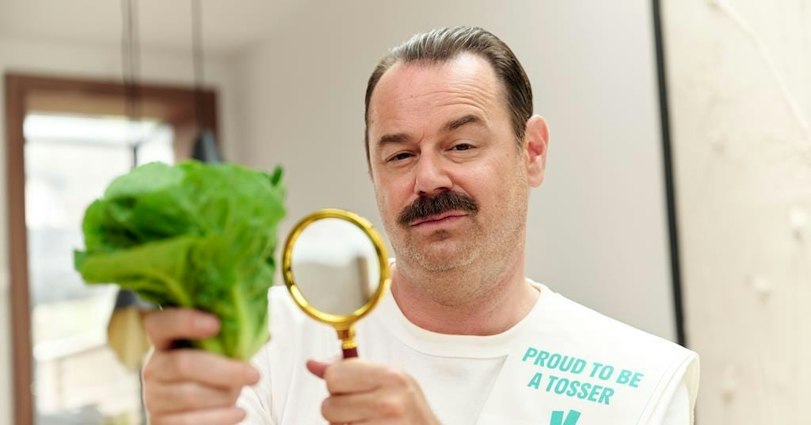 Danny Dyer inspecting a lettuce with a magnifying glass