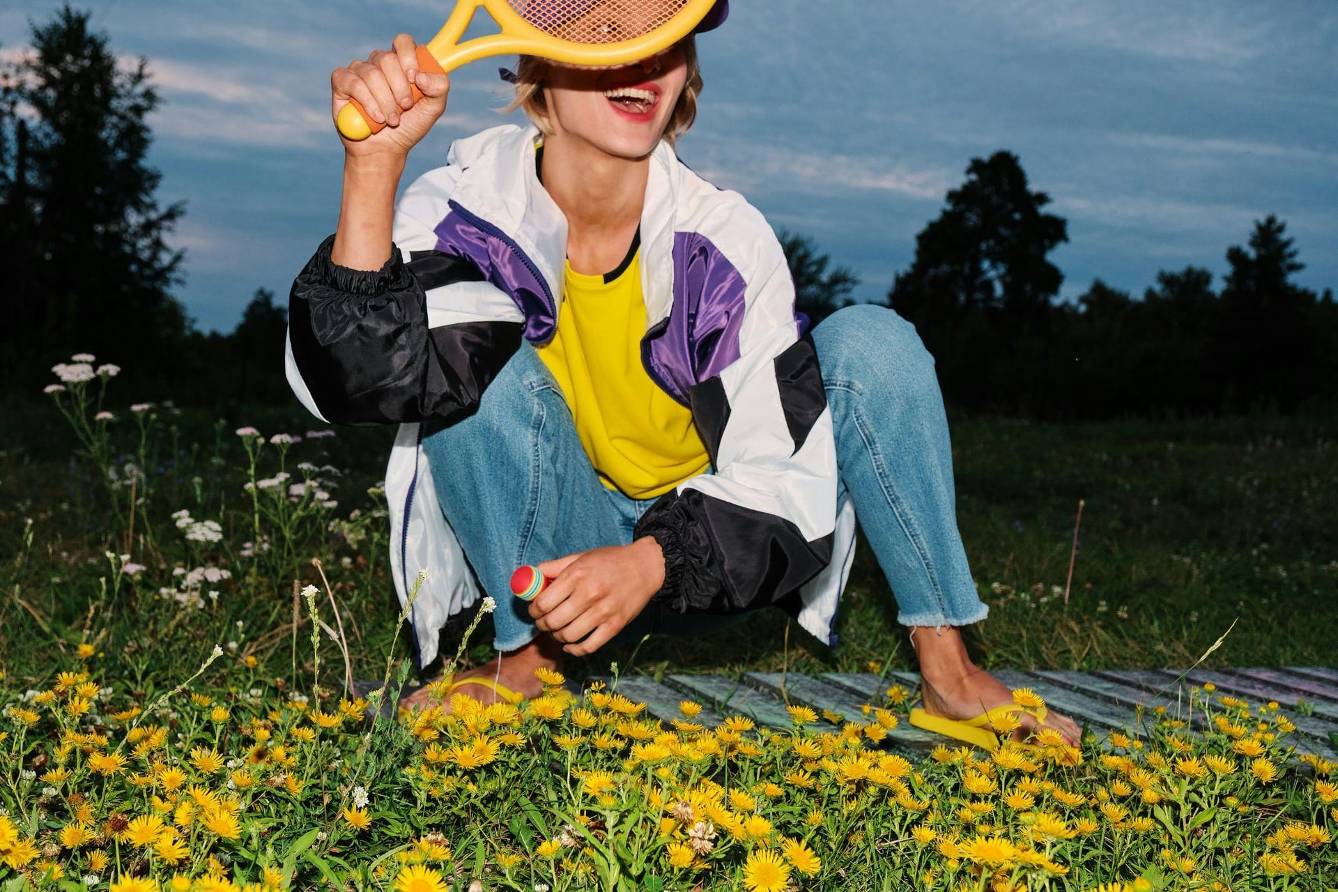 Someone lying in a field of wild flowers