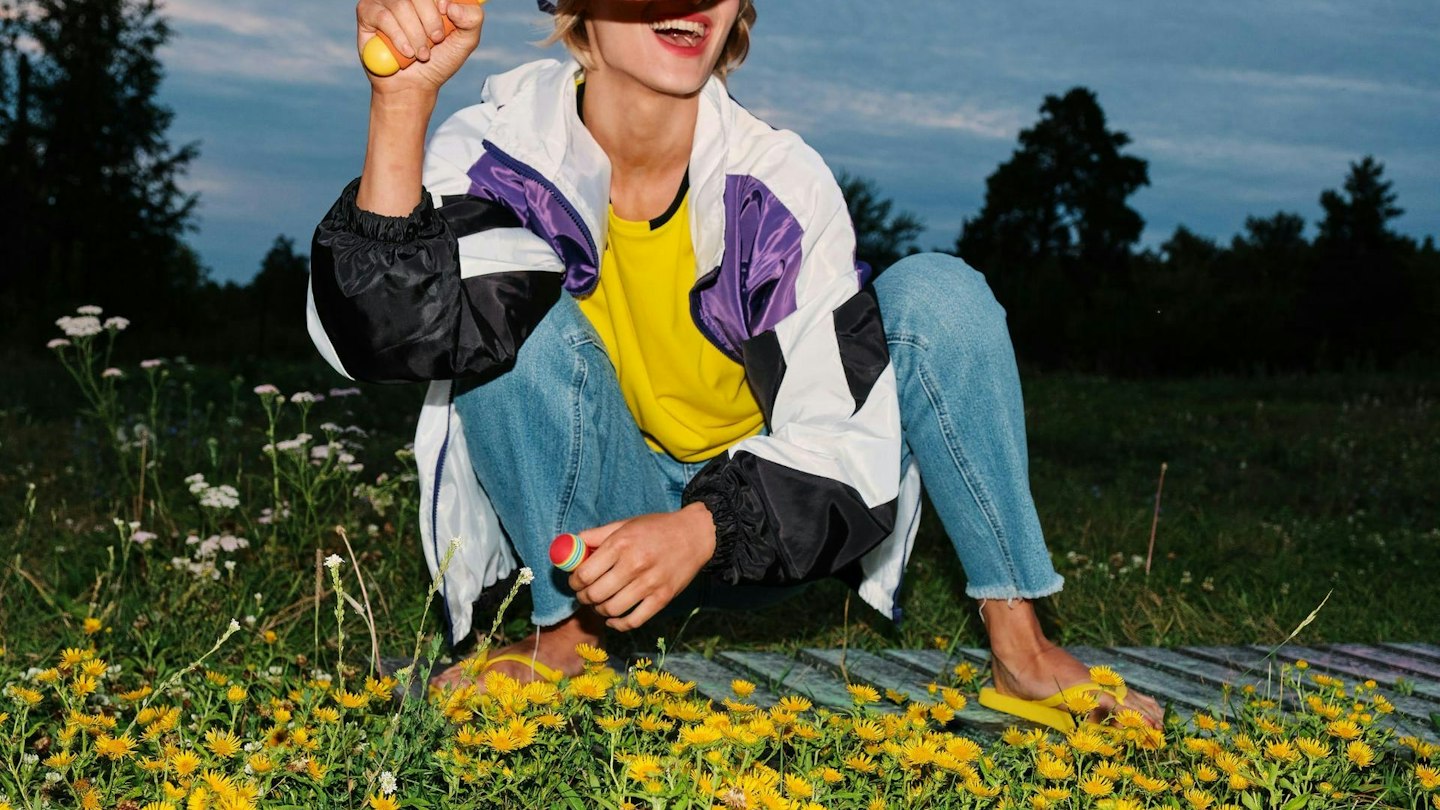 Someone lying in a field of wild flowers