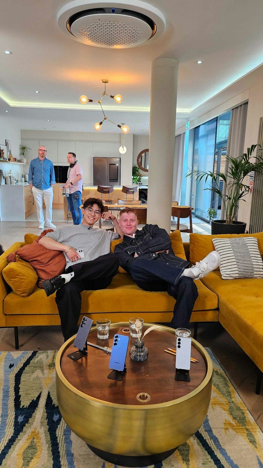The team on a yellow sofa in the lounge