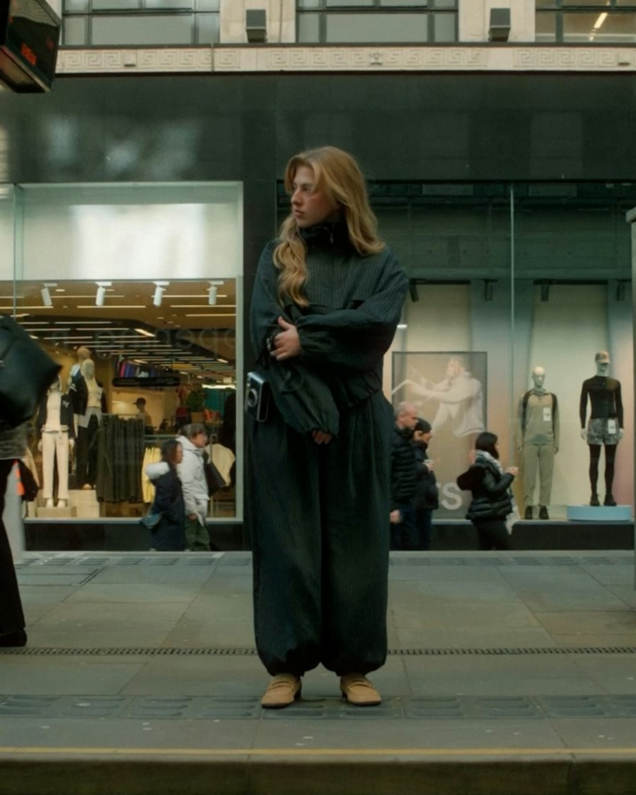 A woman outside a shopfront