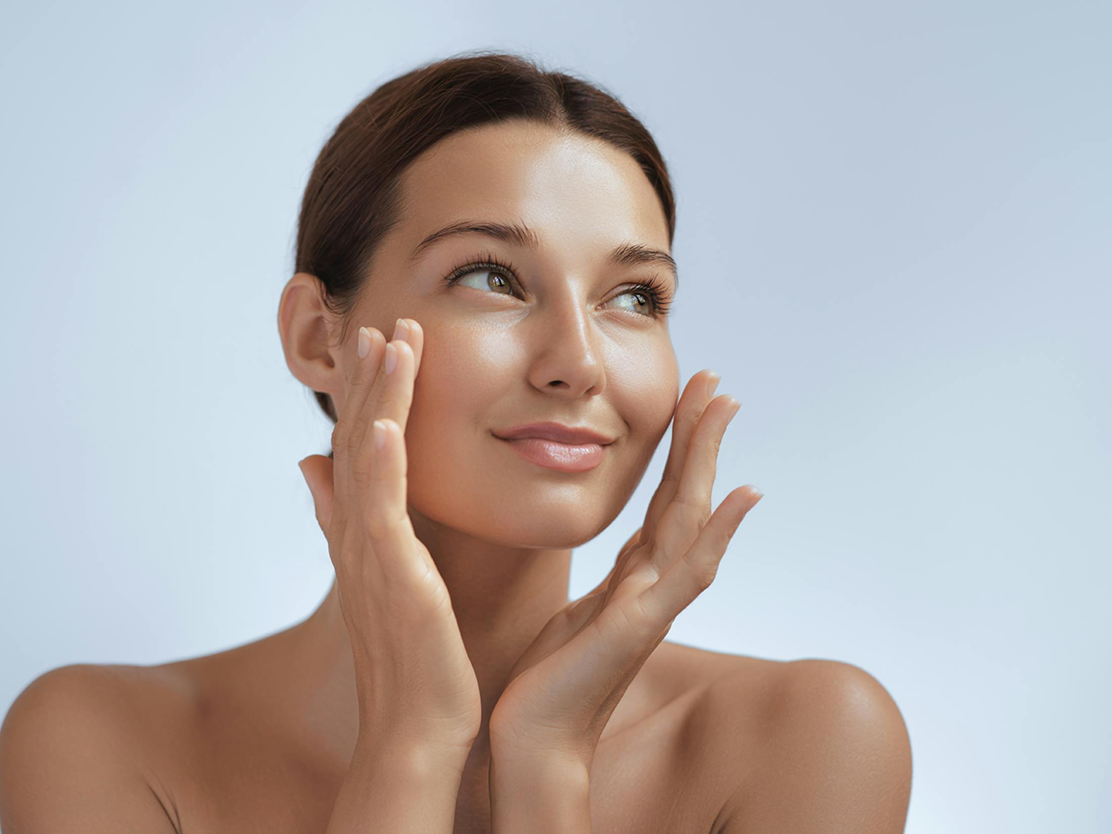 woman touching her cheeks