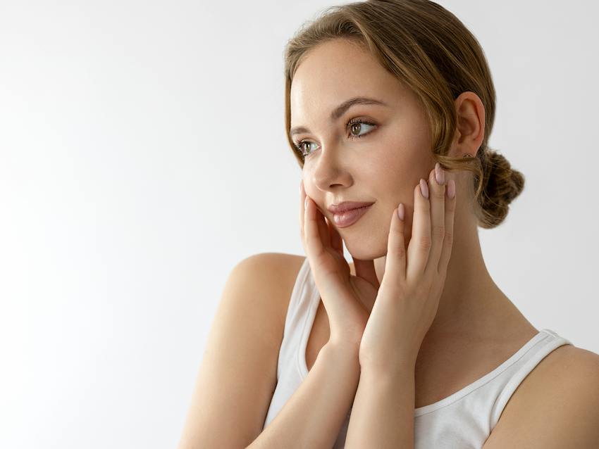 Woman touching her face