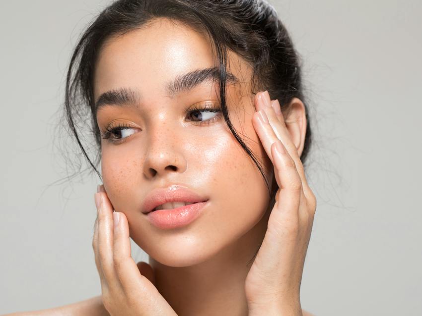 a woman touching her face