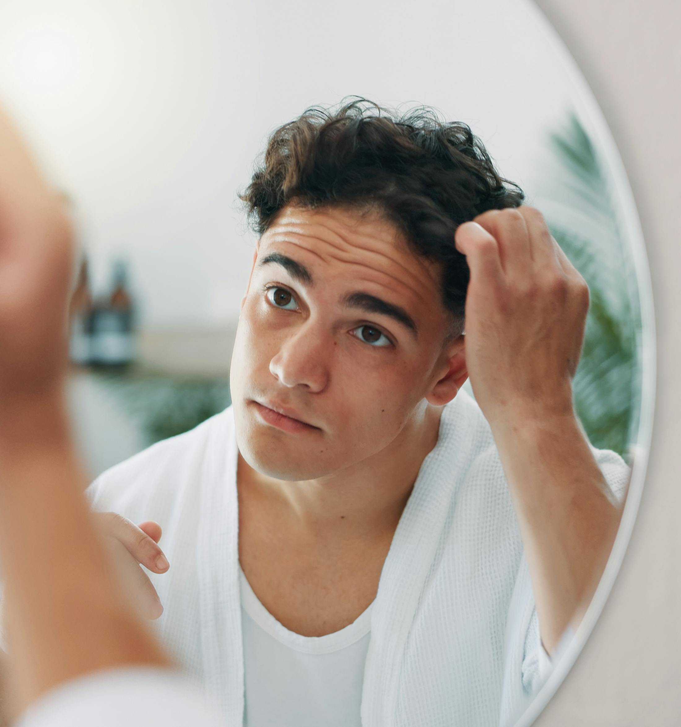 Man touching his hair