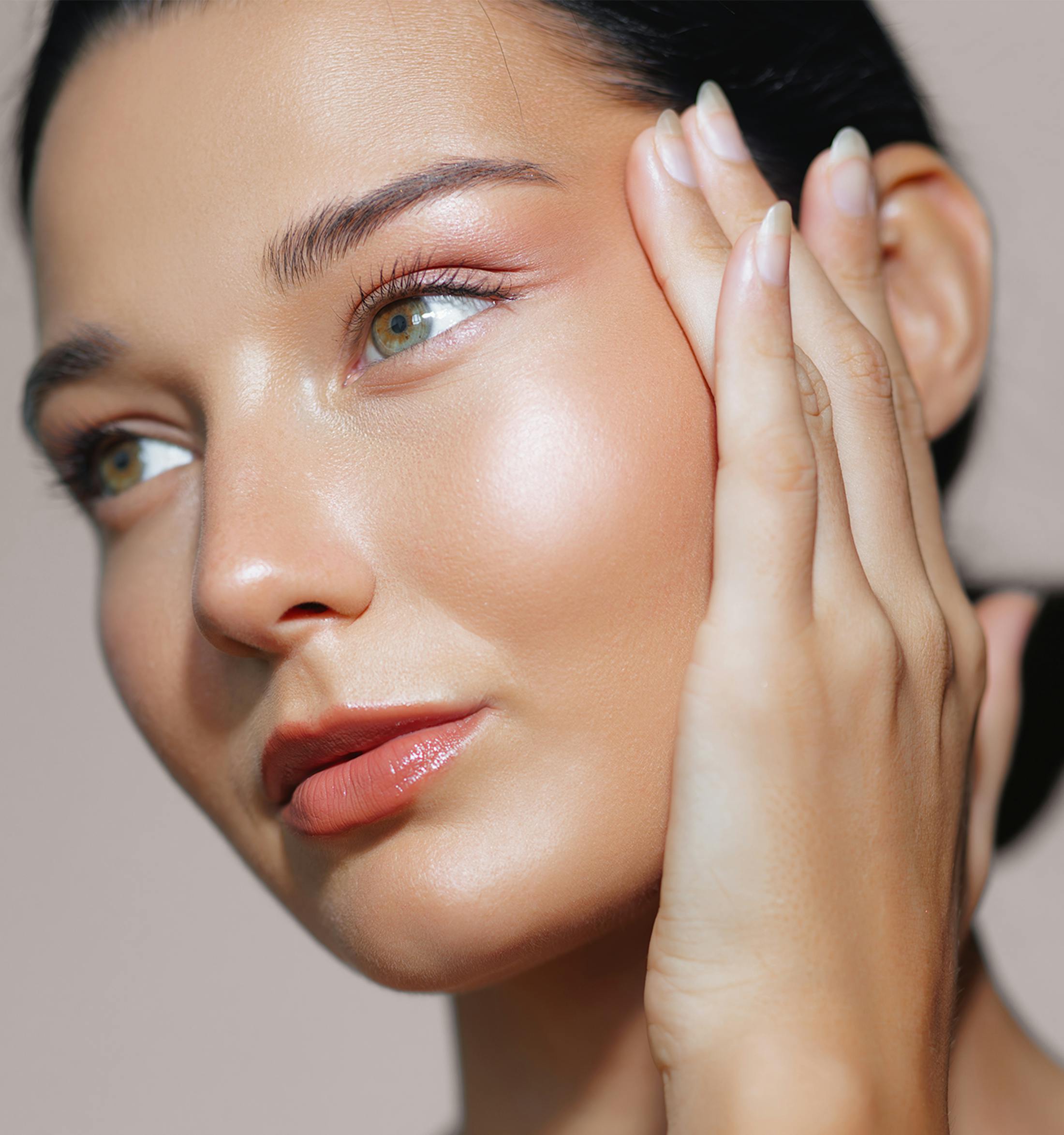 woman touching her face