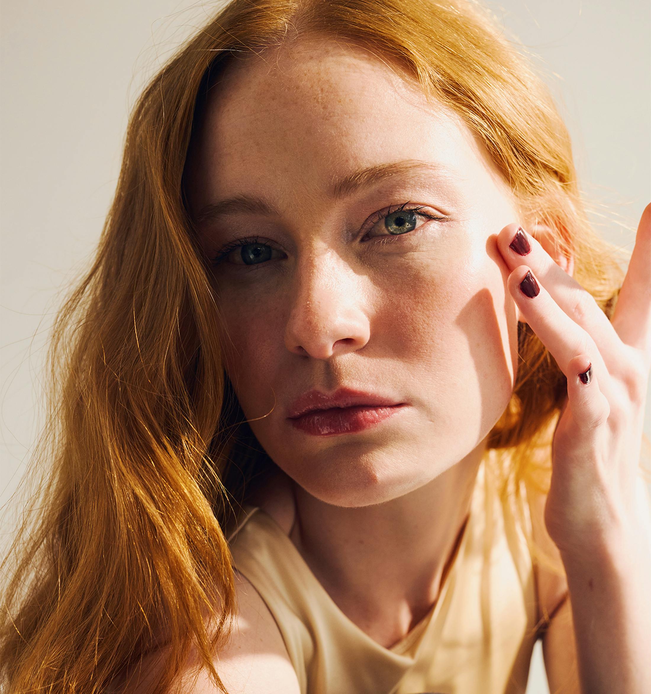 Woman touching her face
