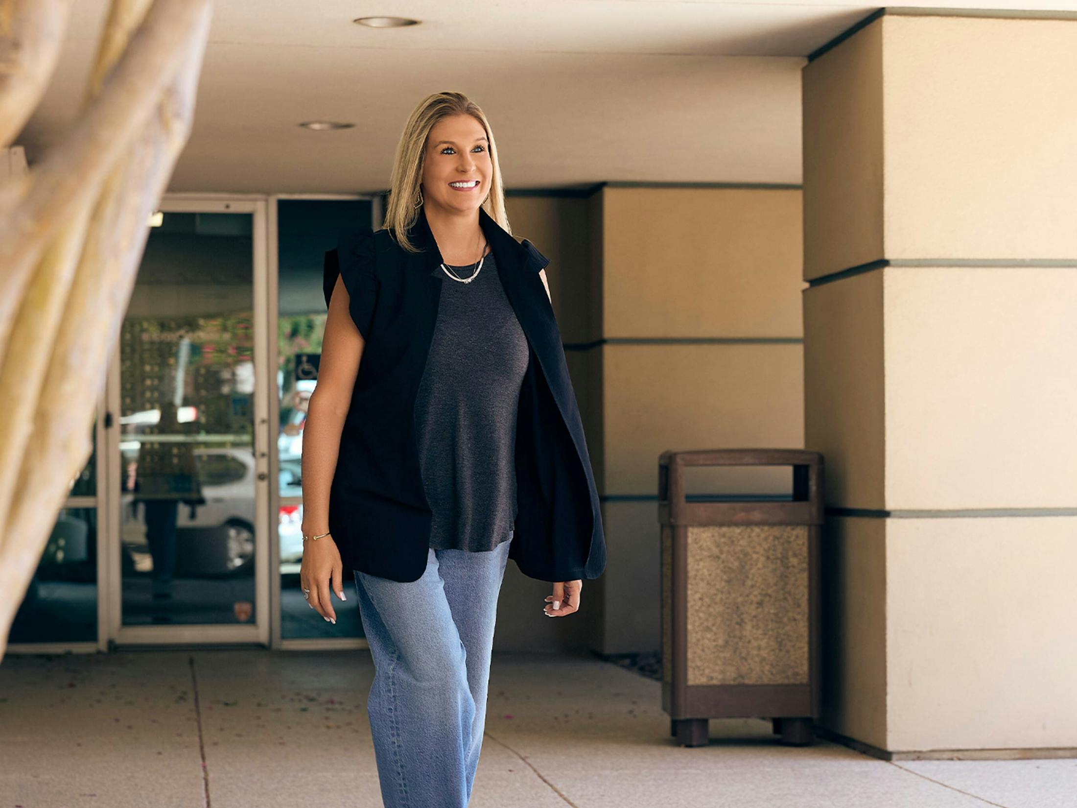 Woman smiling while walking