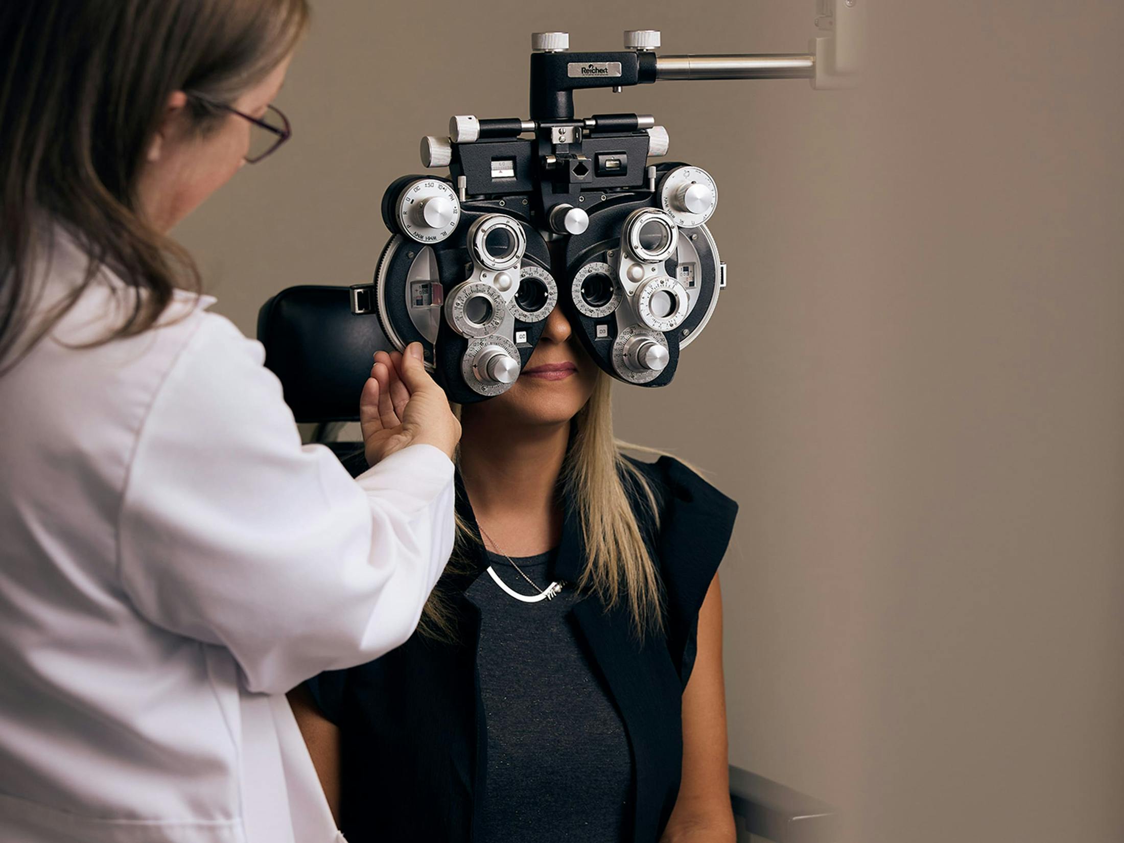 woman and doctor during eye exam