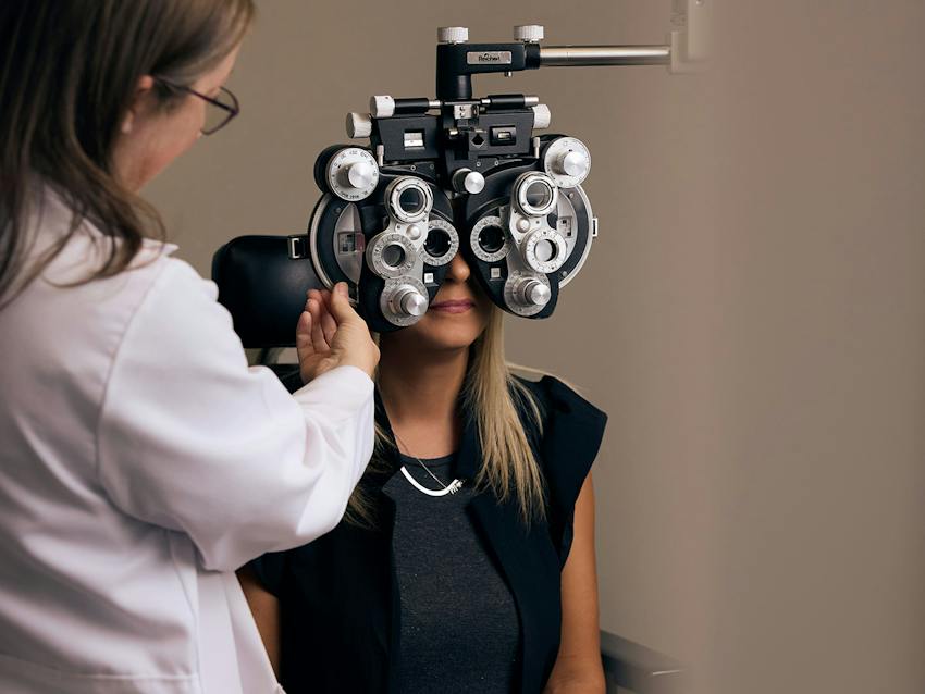 woman and doctor during eye exam