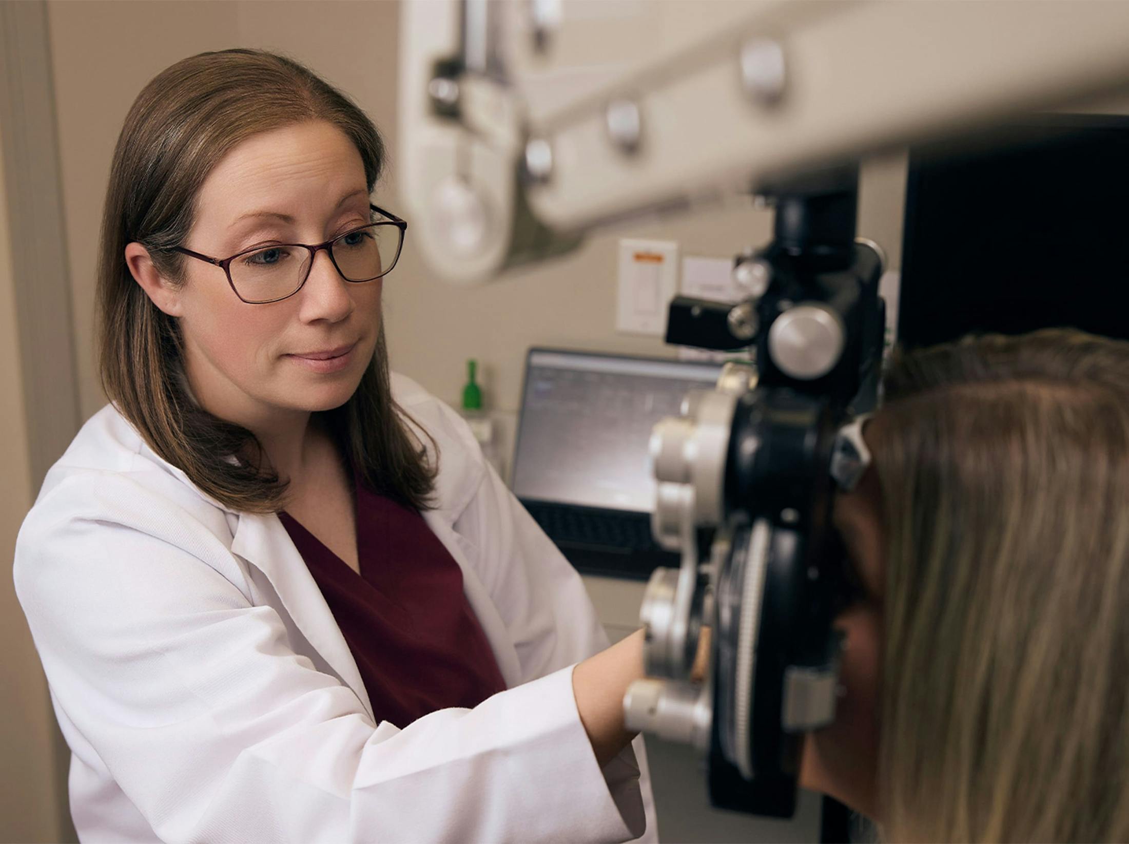 woman and doctor during eye exam