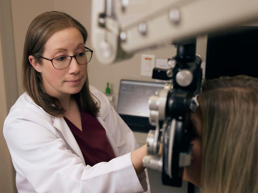 woman and doctor during eye exam