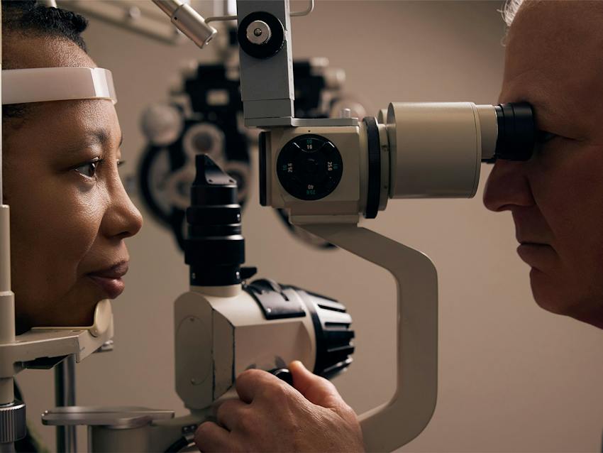 woman and doctor during eye exam
