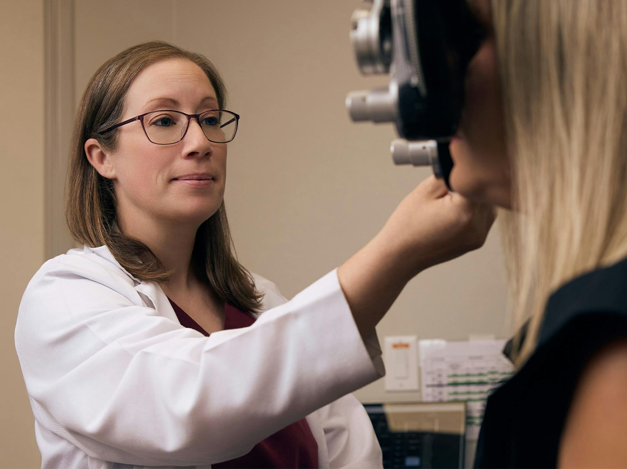 woman and doctor during eye exam