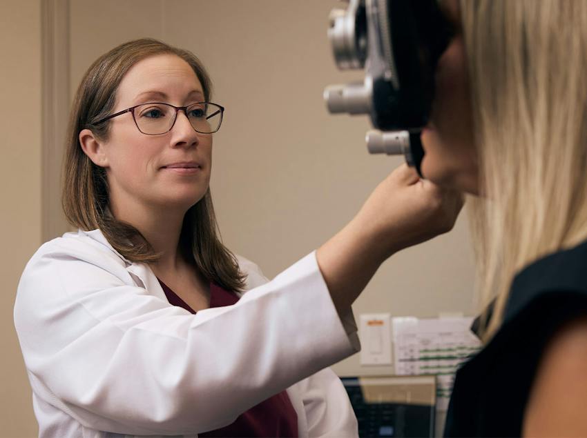 woman and doctor during eye exam