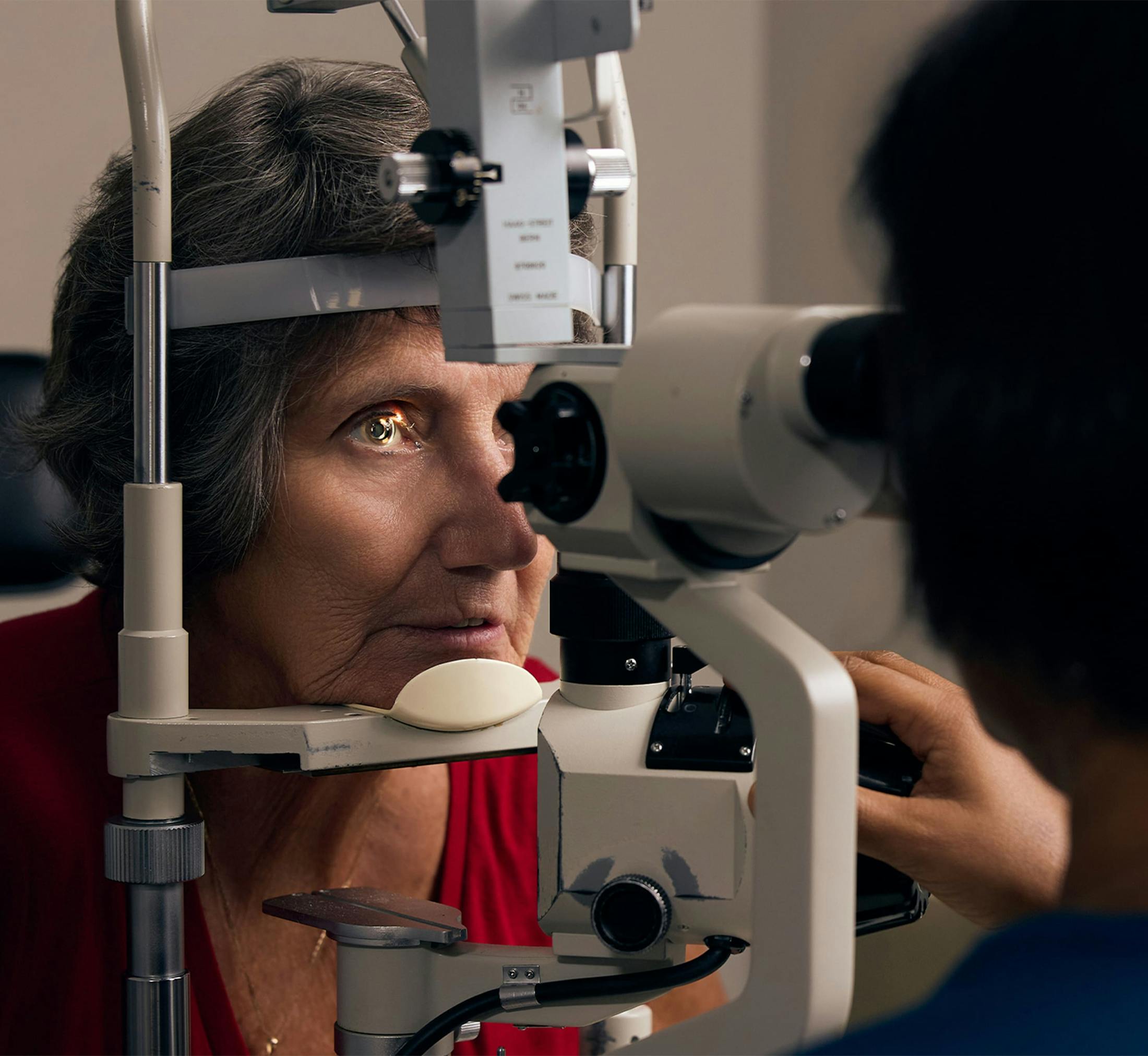 woman and doctor during eye exam