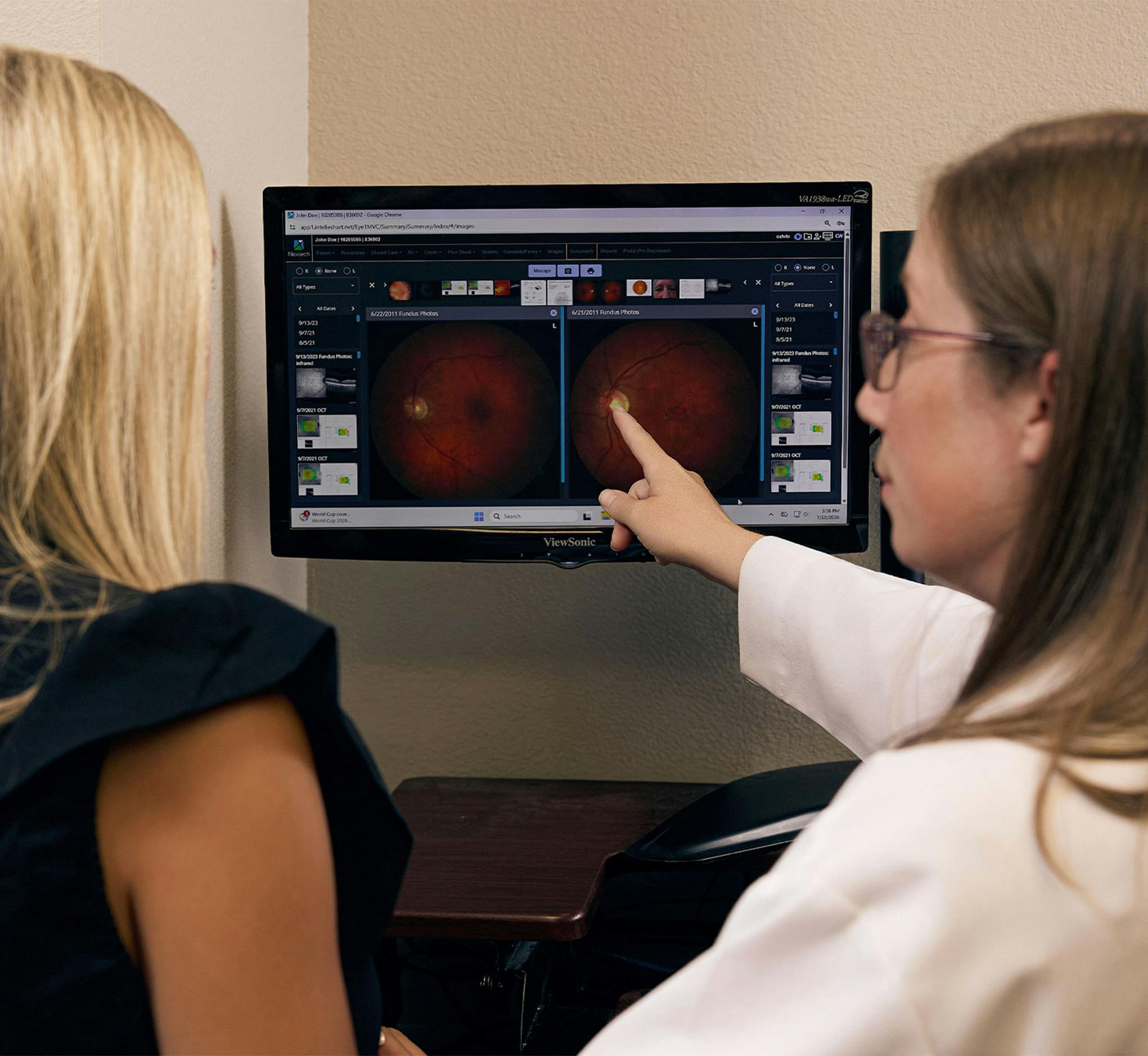 woman and doctor looking at a screen