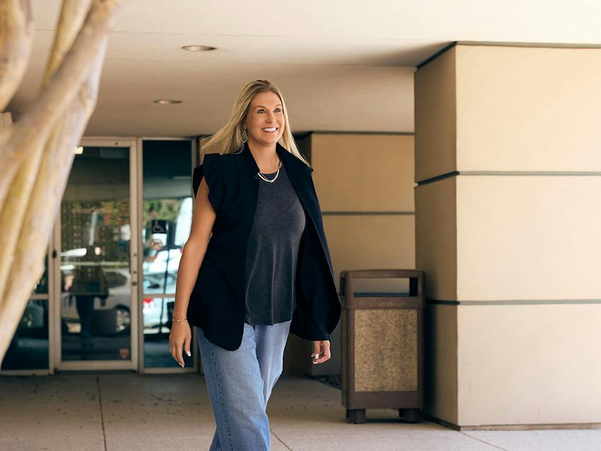 Woman smiling while walking