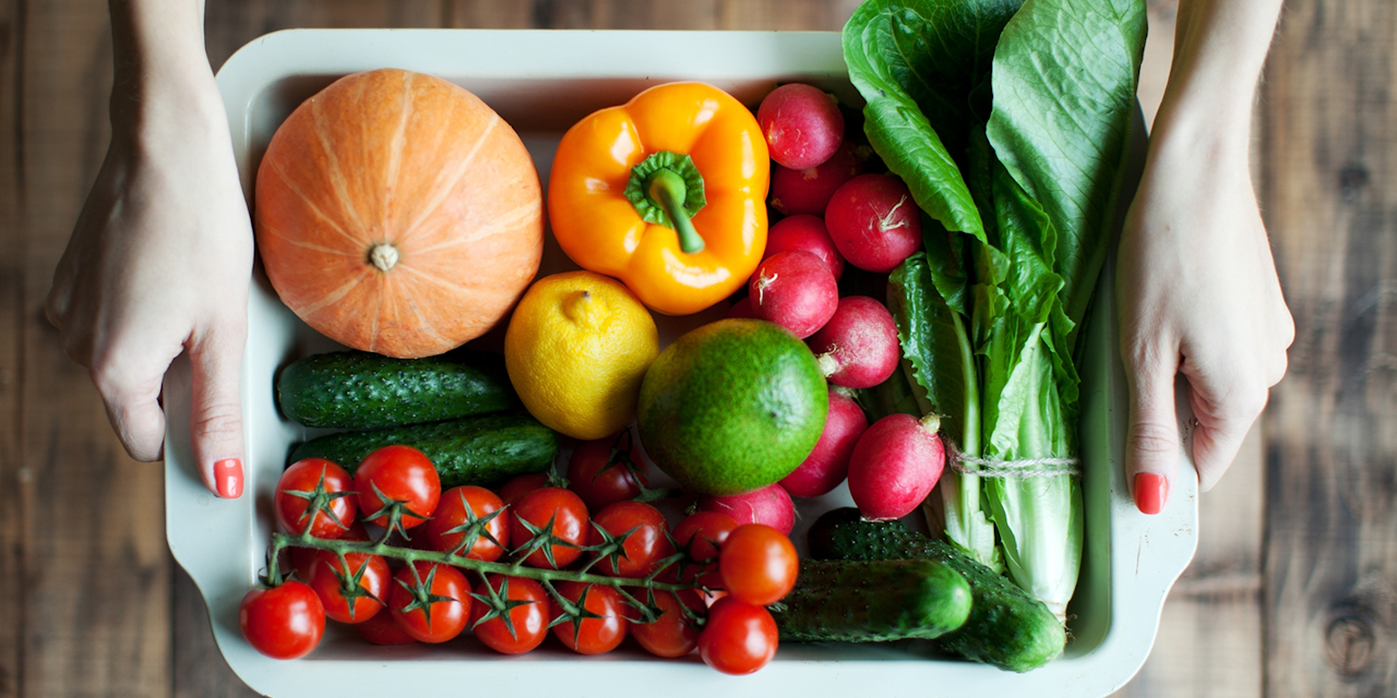 Vegetable tray Person holds a tray with vegetables full of vitamins and minerals