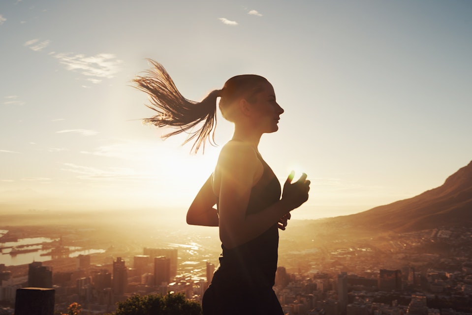 Woman training at sunrise