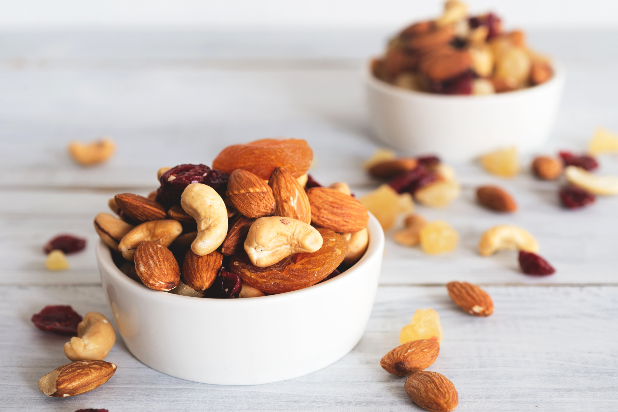 Small bowls of nuts and dried fruits