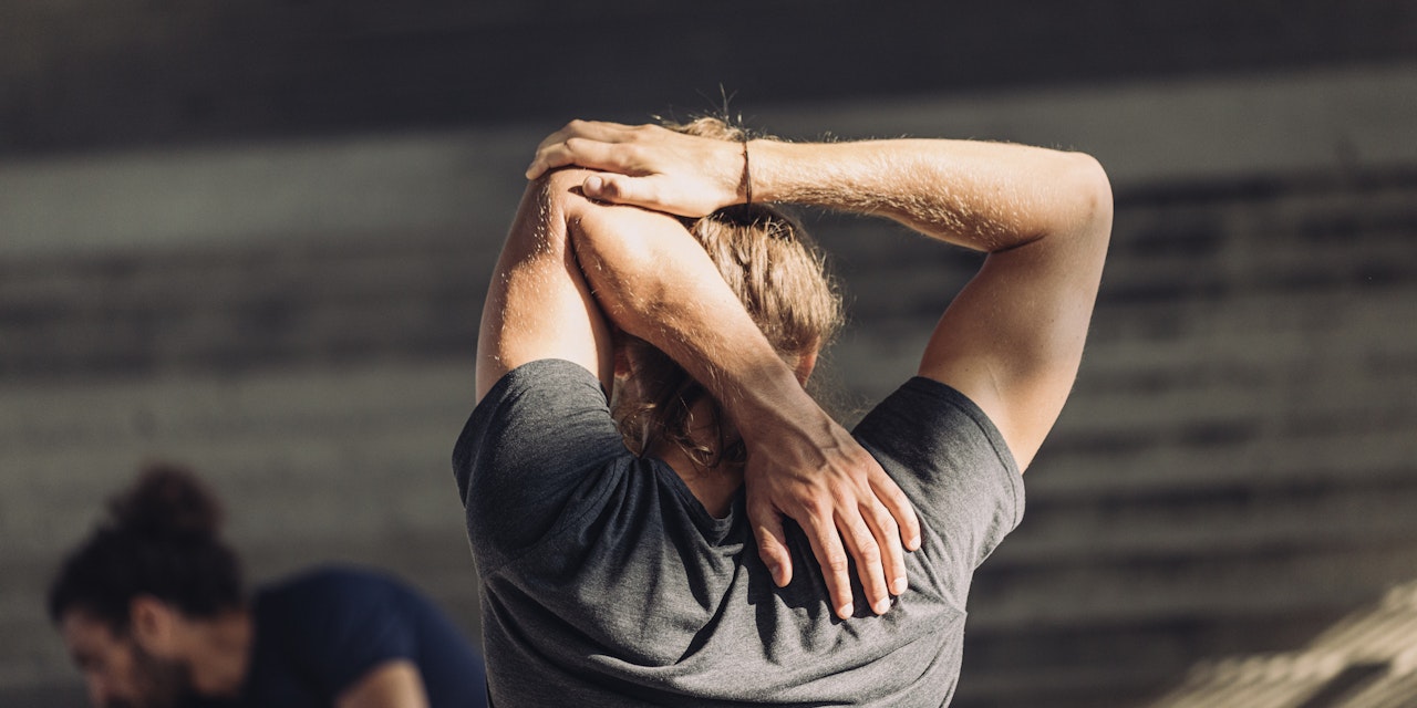 Man stretching his arms