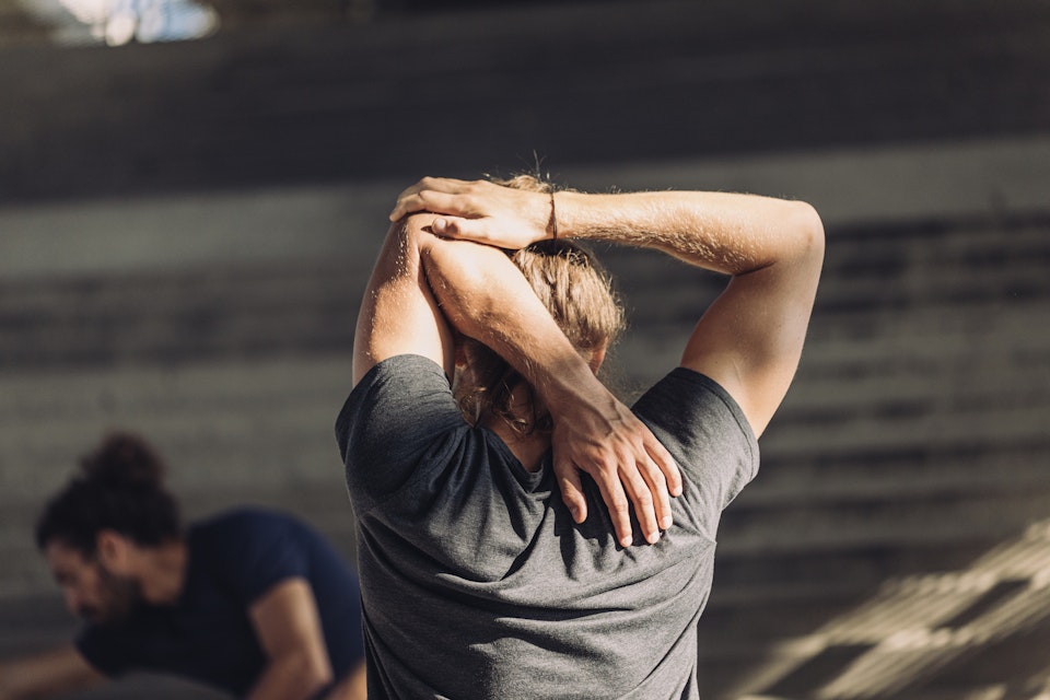 Man stretching his arms 