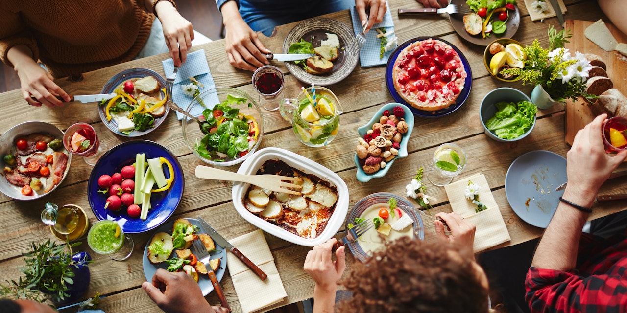 People enjoying a healthy lunch around a table