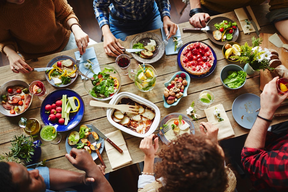 People enjoying a healthy lunch around a table