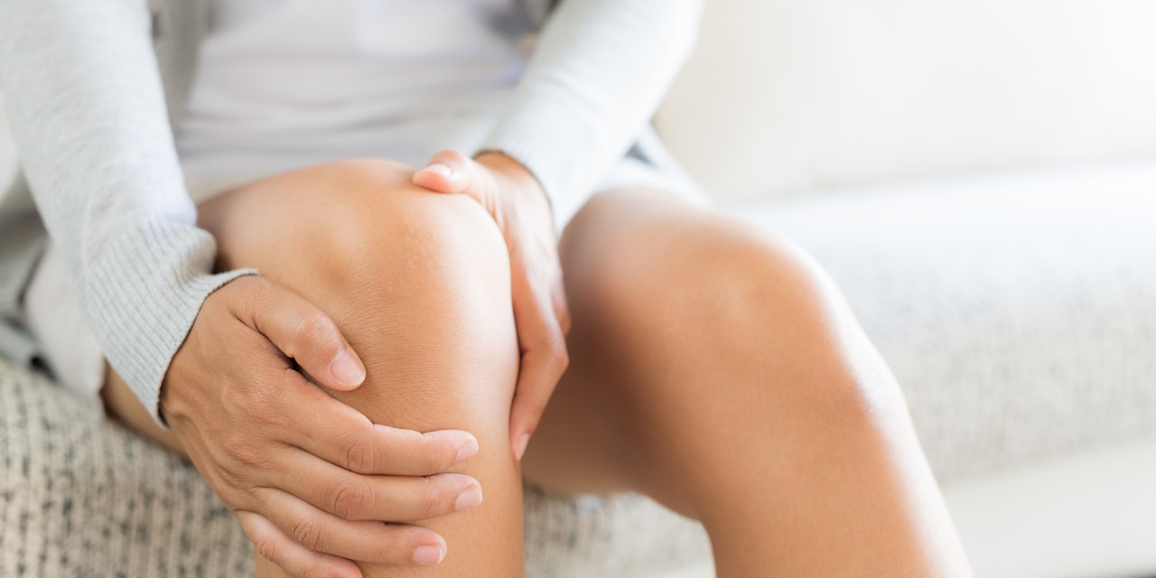 Person suffering from knee inflammation