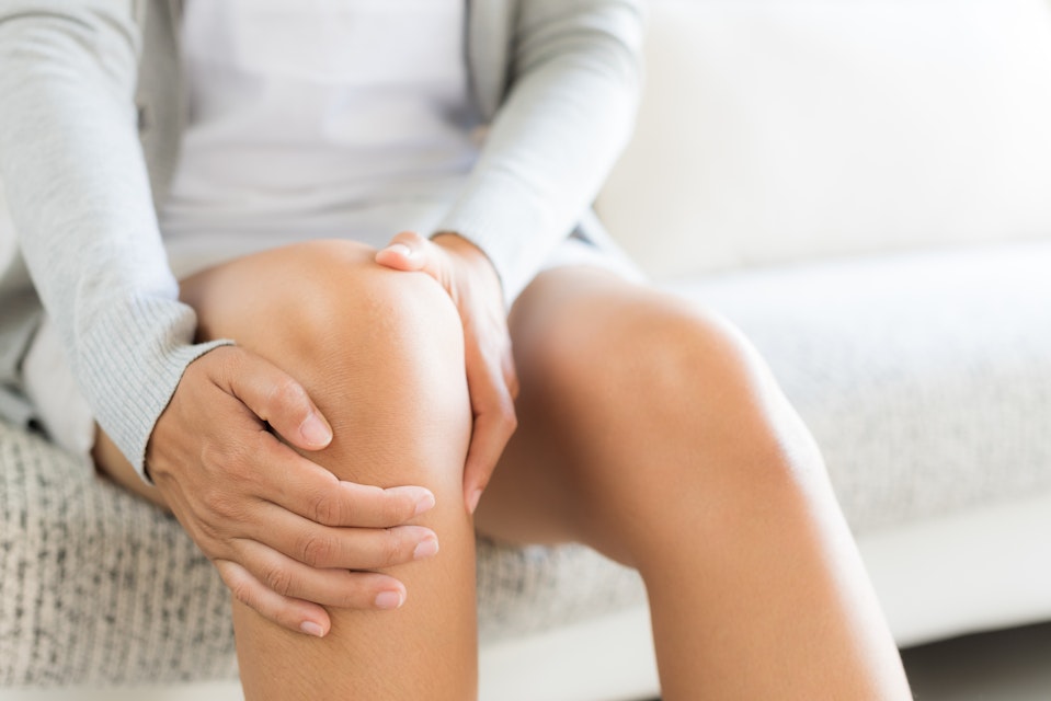 Person suffering from knee inflammation
