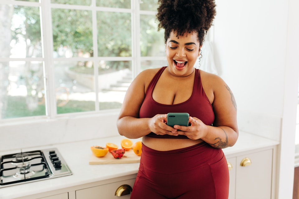 Woman logging her breakfast for the day. 