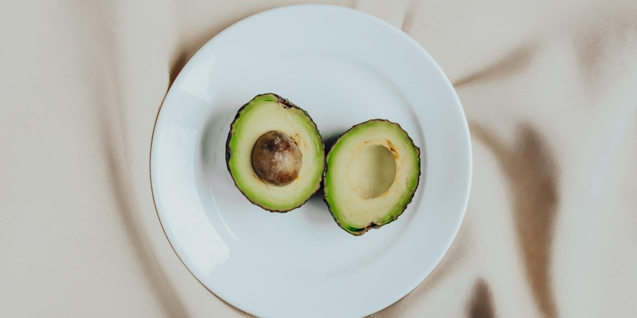 An avocado split in half