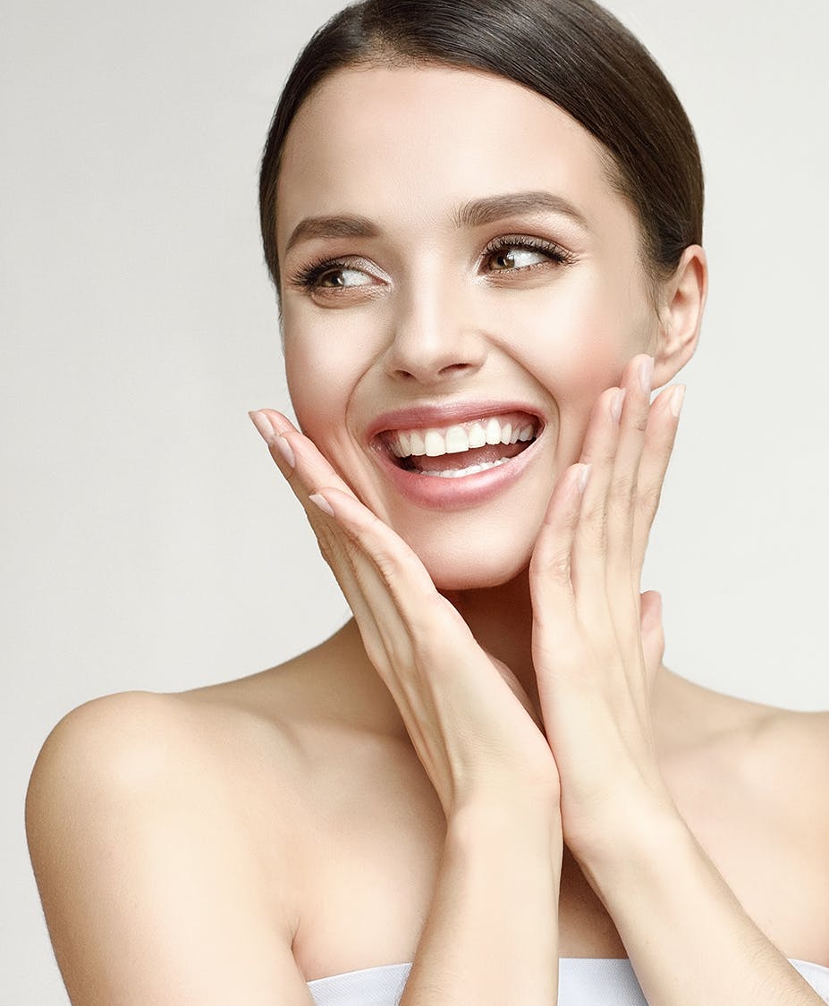 Excited woman touching her cheeks