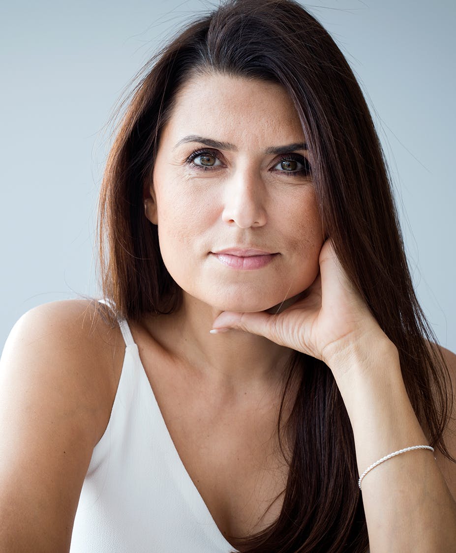 Woman smiling pensively