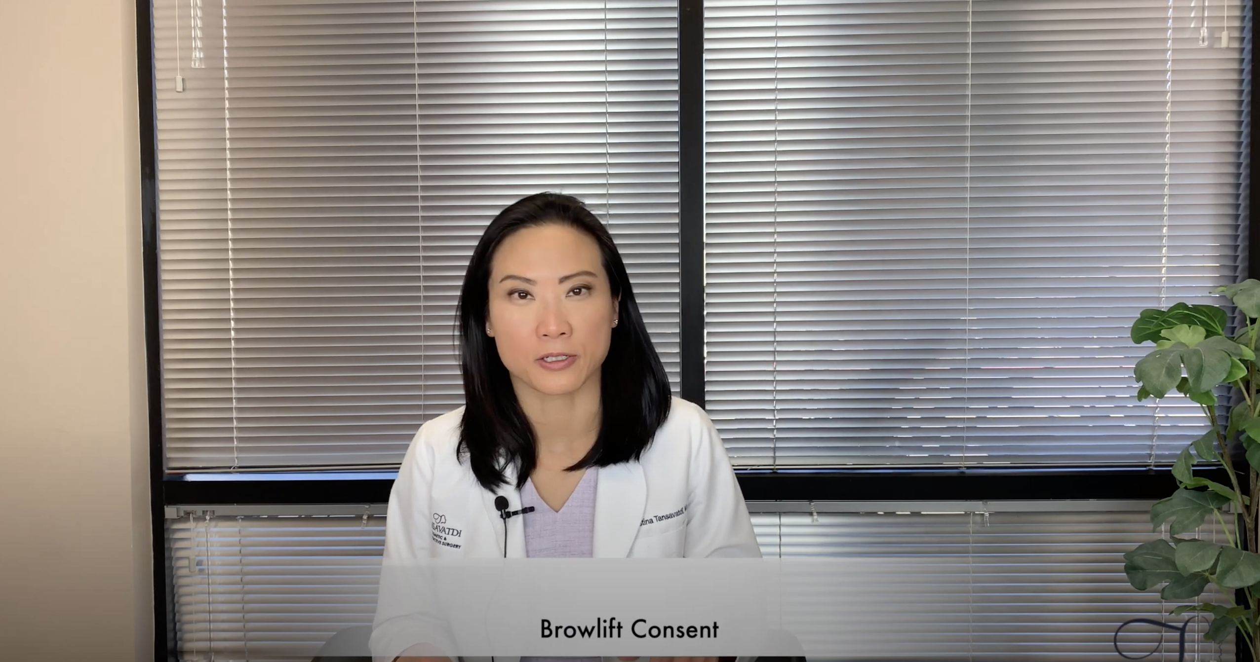 Dr. Tansavatdi looking into camera wearing a white lab coat with the words brow lift consent across the bottom