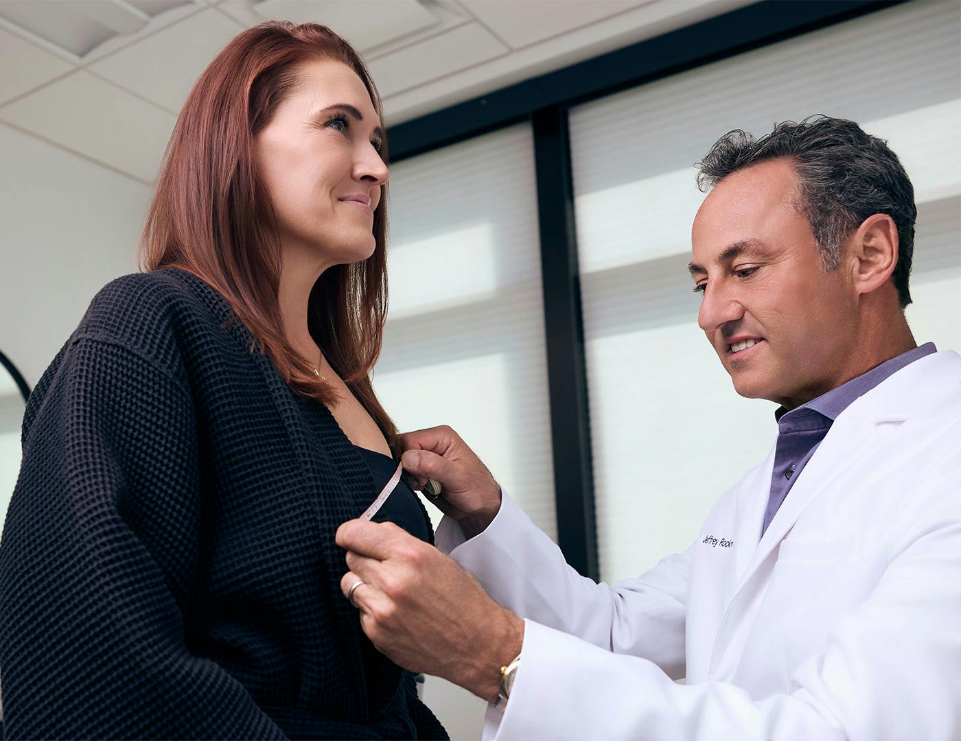a doctor helping a patient