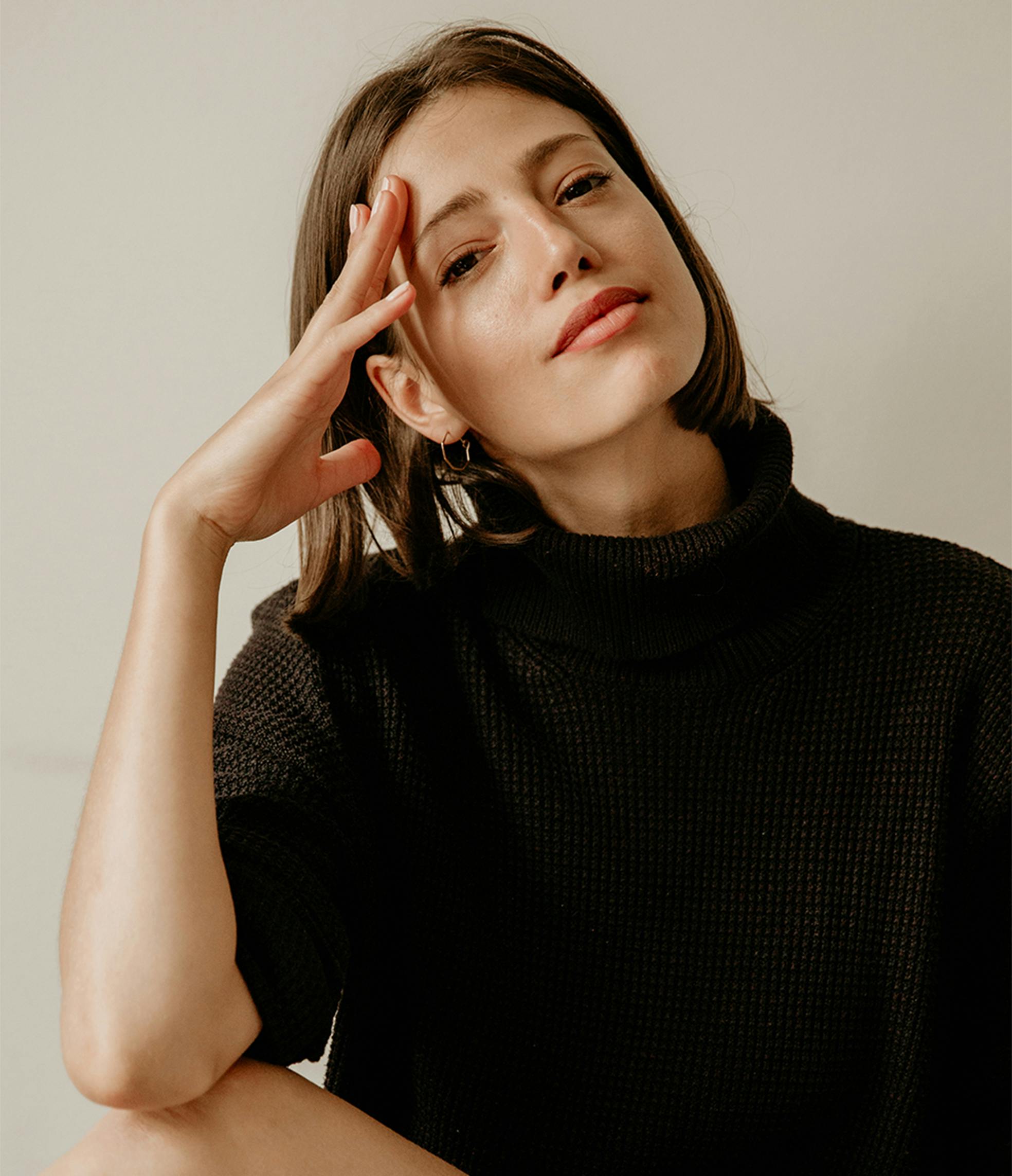 woman touching her face