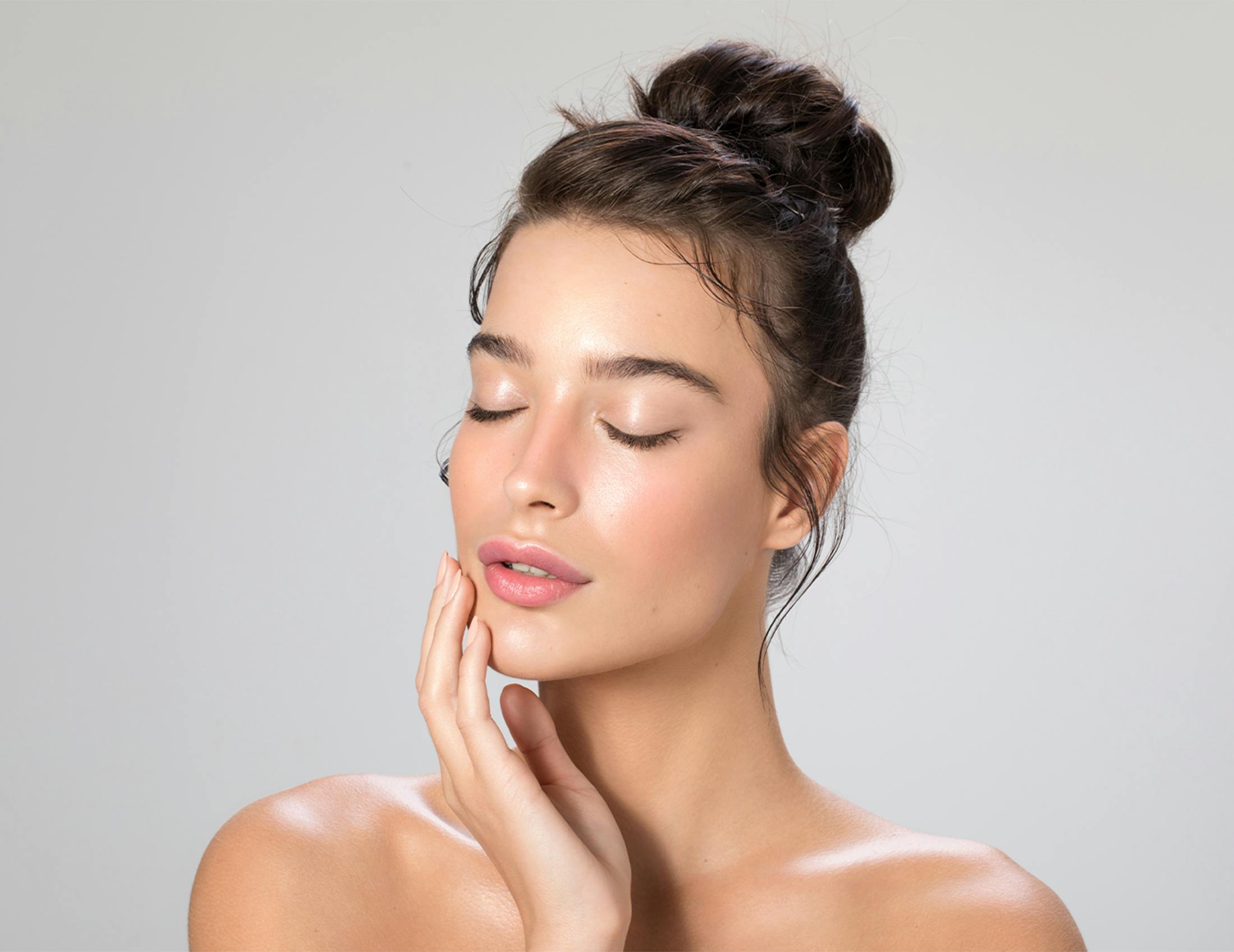 Woman touching her face