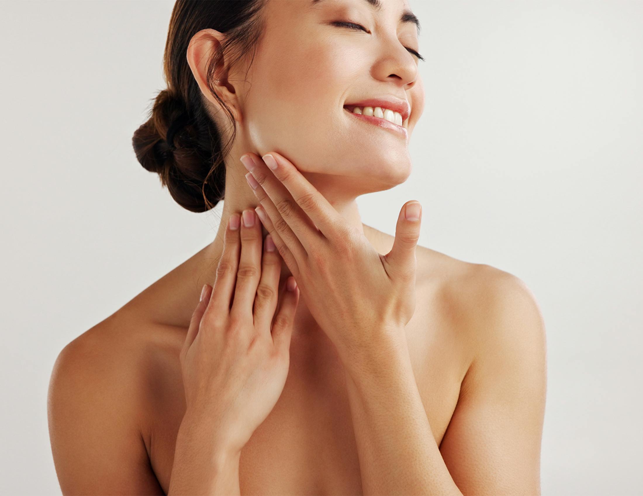 Woman touching her neck