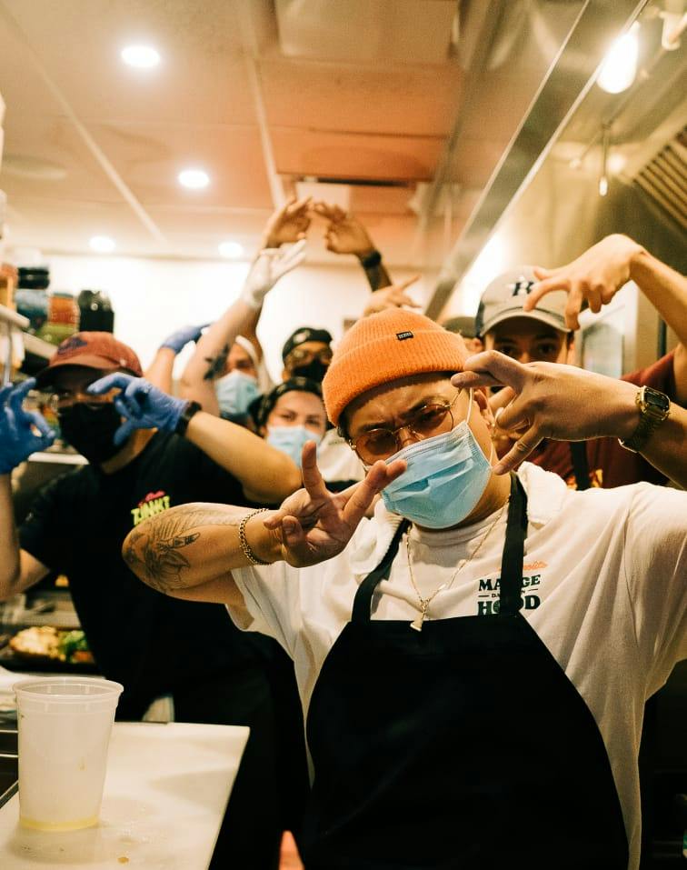 The crew posing behind the counter