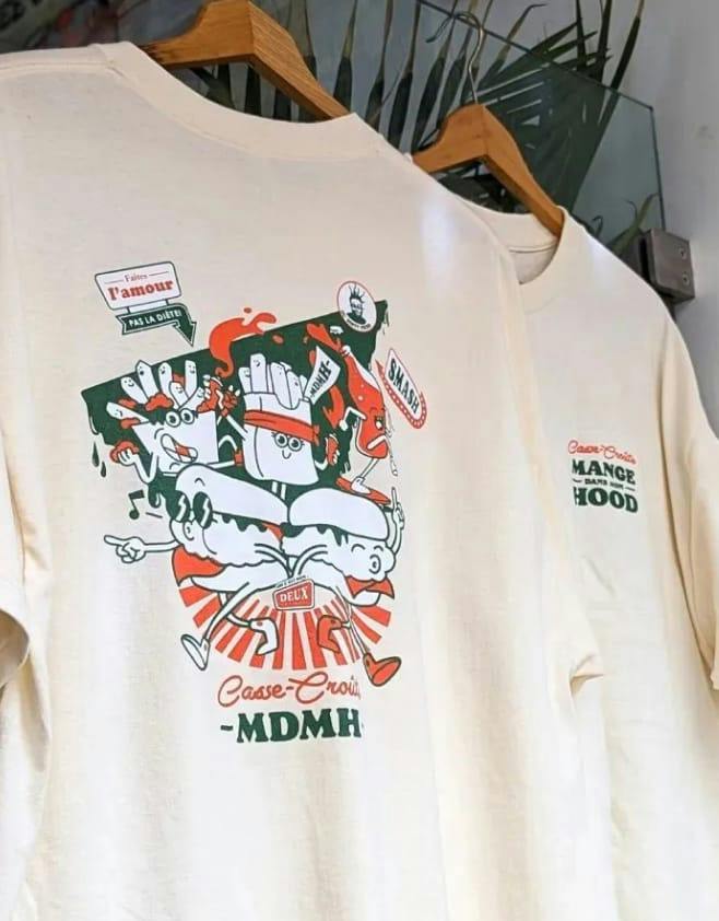 Cream Smash Bros T-shirt on a hanger