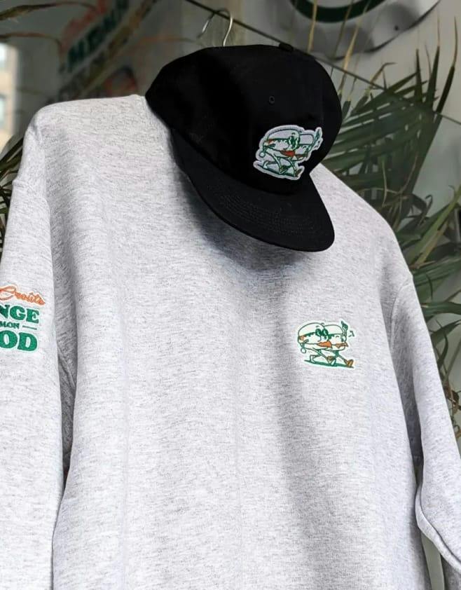 Grey MDMH crewneck and black cap