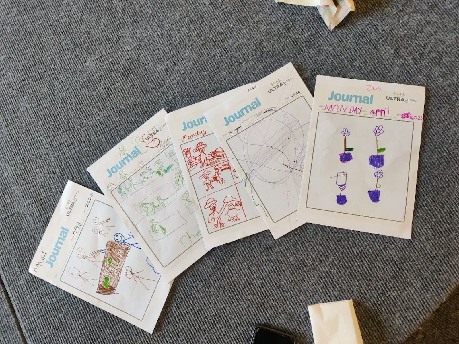 Children's learning journals from ULTRA_school, with drawings and dates