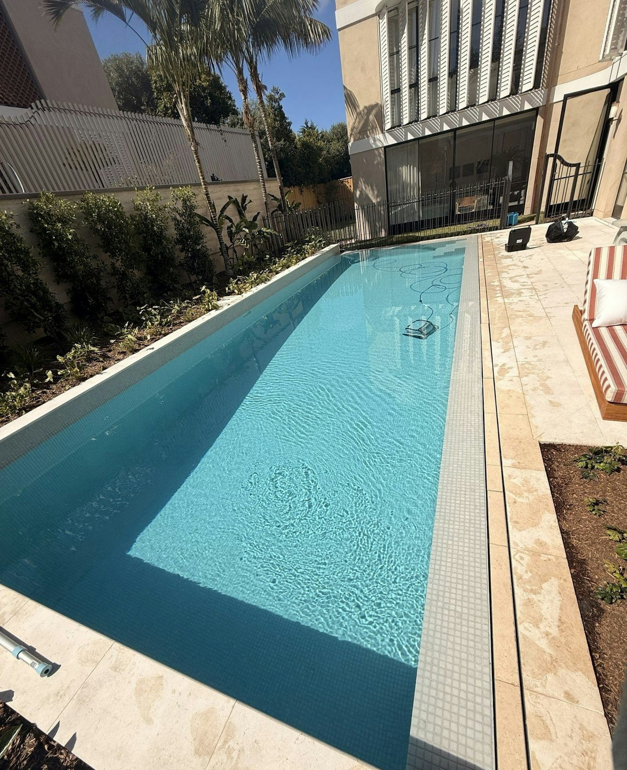 Lap pool with sandstone coping