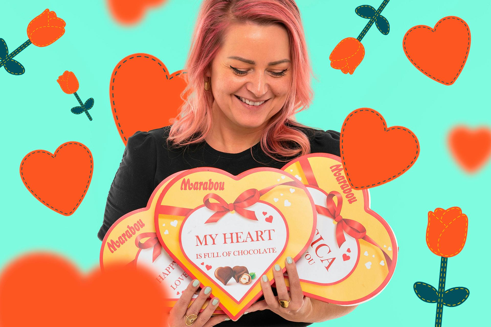 Romantic image of a woman with pink hair holding heart shaped custom chocolate boxes