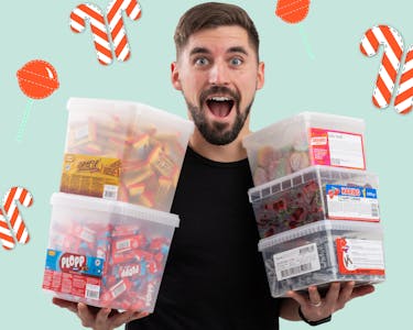 excited man with boxes of candy