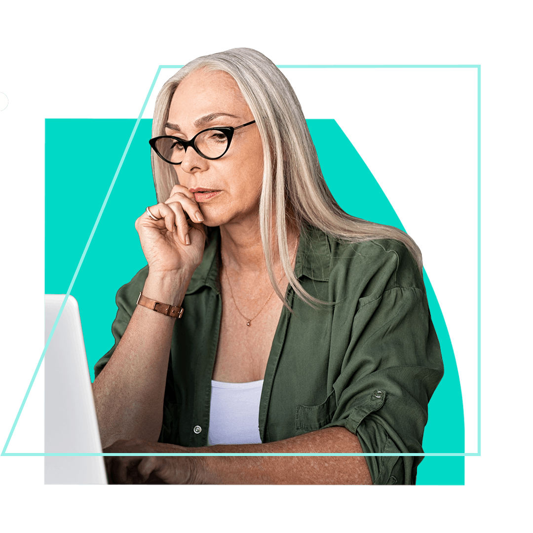 Woman looking thoughtfully at computer screen